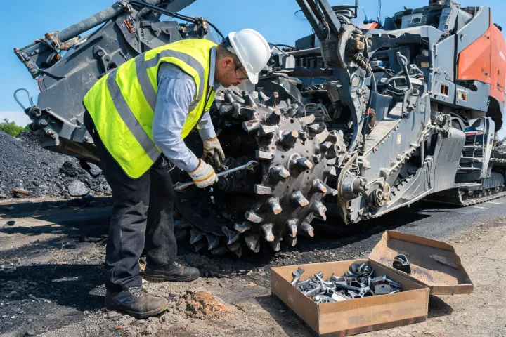 Field technician servicing reclaimer rotor